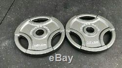 (2) 35 lb Olympic Weight Plates. PAIR OF FITNESS GEAR 35 LB OLYMPIC GRIP PLATES