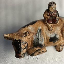 Cast iron ox with chinese boy reading a book. Ox weight is 2 1/2 lbs